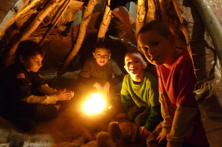 Cub Scouts in a teepee